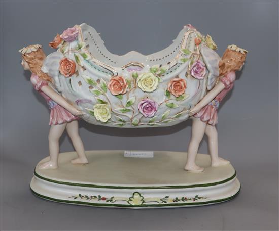 A Continental floral encrusted porcelain centrepiece height 26cm